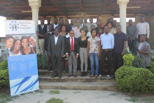 Participants of the project launch pose for a photograph with the Blantyre City Mayor.