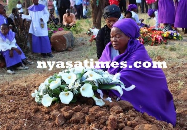 Paying last respects, Mbewe's wife . -Photo Jeromy Kadewere.