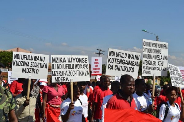 People carried placards demonstrating human rights- photo (C) Stanley Makuti