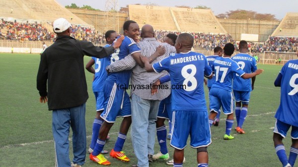 Nomads players celebrate