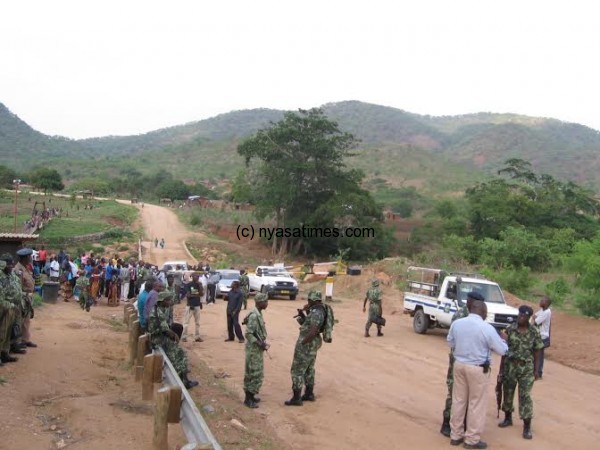 Out of bounds: Police block irate citizens from storming the mine.-Photo by Tiwone Kumwenda, Nyasa Times