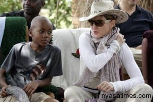 Madonna with her adopted Malawian son David Banda on her recent trip to Malawi (Picture: AFP)