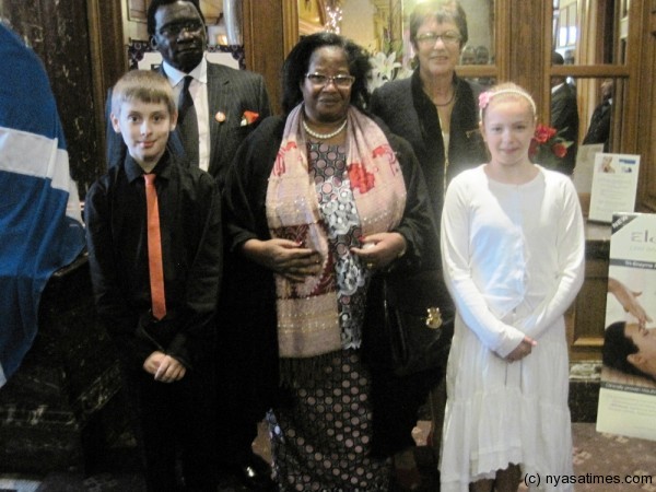 President Banda and the First Gentleman pose with Stenhouse Full Primary School pupils Alexander Dennis, Rabecca Tant and their Headteacher Marlene Galashan on arrival in Edinburgh, Scotland