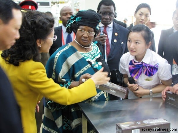 President Banda being briefed on cigarette manufacturing at HONGYUNHONGE Group factory