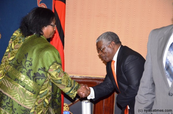 President Banda congratulates Brown Mpinfanjira after he was sworn in as minister 
