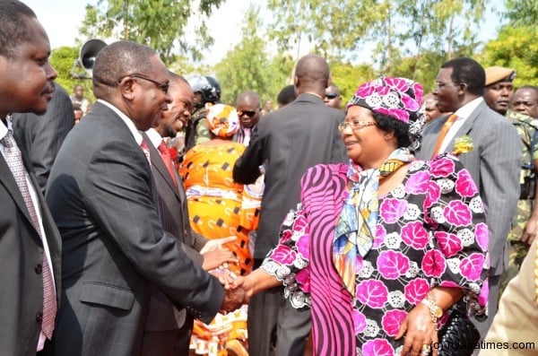 President Banda greets CEO for Blantyre City Assembly Ted Nandolo when she arrived to lay a foundation stone for the construction of a Health Centre at Nancholi on Friday