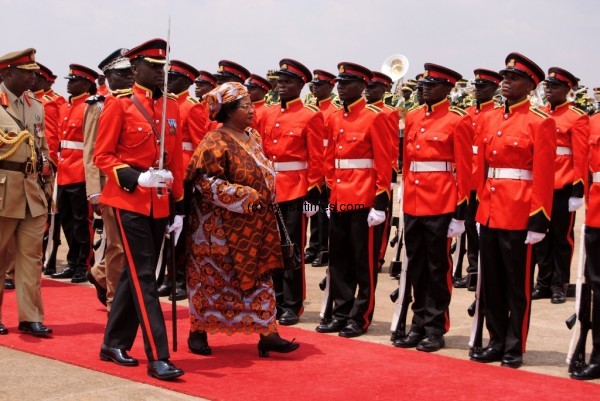 President Banda inspecting the guard of honour on arrival at Chileka Airport in Blantyre.Picture by Francis Mphweya-MANA.