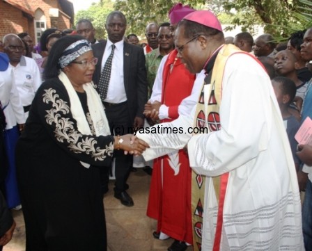 President Banda is welcomed by Rev Tarsizio Ziyaye at St .Peters Angican Parish Church in Lilongwe on the Way Of the Cross - Pic by Stanley Makuti
