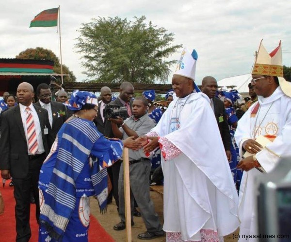 President  Banda congratulates Bishop Martin Mtumbuka during his priestly ordination silver jubilee, Pic by McCarthy Mwawamba, Mana