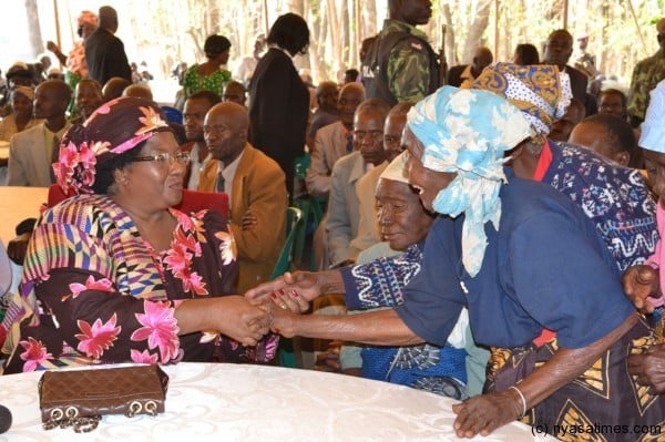 President Dr Joyce Banda interacting with the senior citizens. pic by Felix Washon. MANA