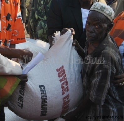 Receiving maize  from President Joyce Banda