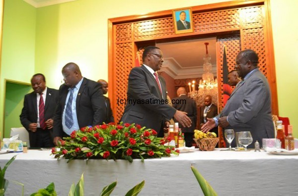 President Mutharika meets the media at Sanjka: Greeting Media Council of Malawi chair Prof Wiseman Chijere Chirwa: Gave K50,000 handouts to journalists