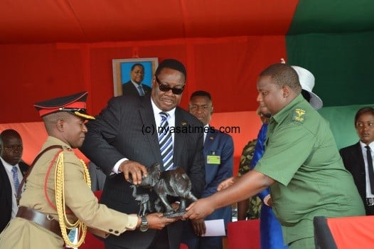 President Mutharika receives a gift of a curved elephant from Information and Tourism MinisterKondwani Nankhumwa - Pic by Stanley Makuti