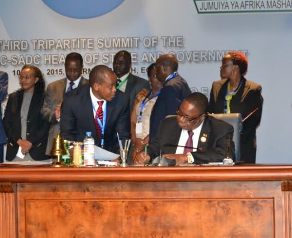 President Mutharika signing the pact-. .Picture by Francis Mphweya-MANA