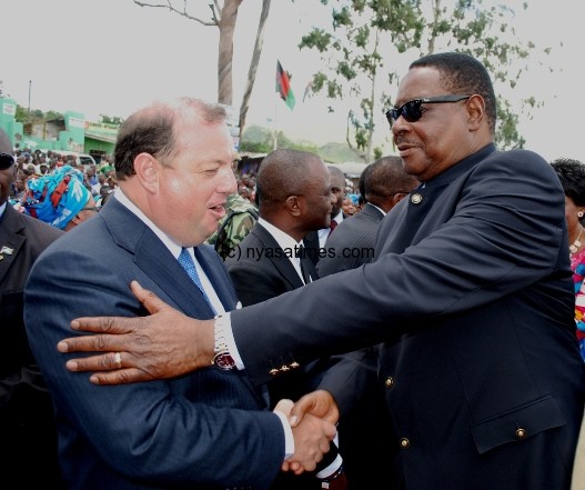 President Peter Mutharika greets Gilberto Rodriques of Mota Engil at the official opening of John Chilembwe Highway in Blantyre on Friday.Cgovati nyirenda. mana