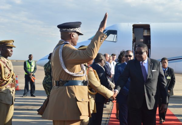 President Peter Mutharika is welcomed by Police and Army Officers on arrival at Kamuzu International Airport(C)Stanley Makuti