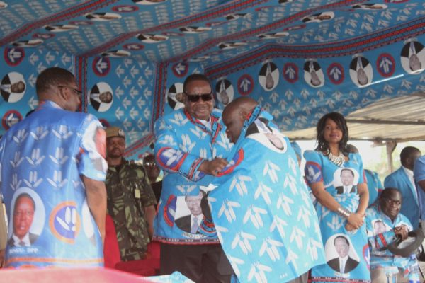 President Peter Mutharika welcomes Binton Kumtsaila during the rally at Masintha ground(C) Stanley Makuti