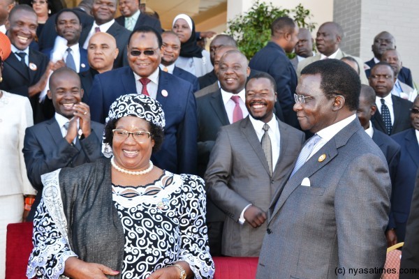 President  Banda interacts with MPs after posing for a group photograph