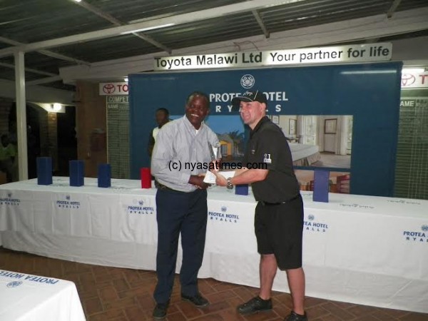 Protea Ryalls Hotel GM Lehner congratulates overrall champ Neil Nyirongo