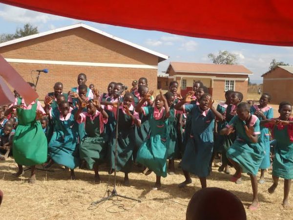 Pupils of Mpita primary school expressing happiness during classroom block's handover ceremony