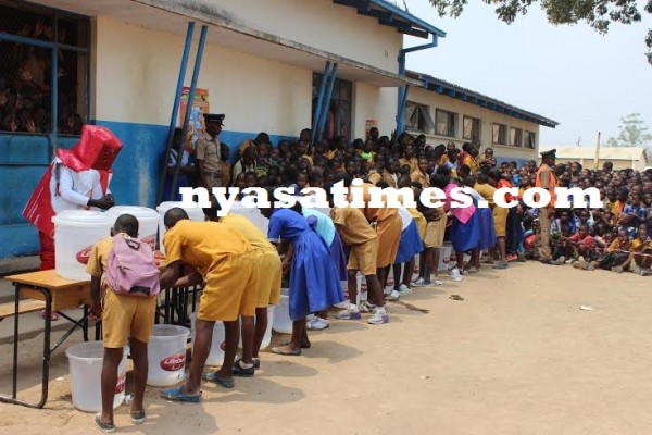 Pupils washing hands with Lifebouy