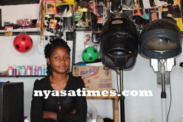 Rahaby waiting for electricity in her saloon -.Photo Jeromy Kadewere