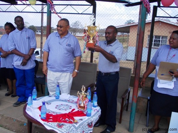 Rainbow Paints Sales Marketing manager receiving the trophy...Photo Jeromy Kadewere
