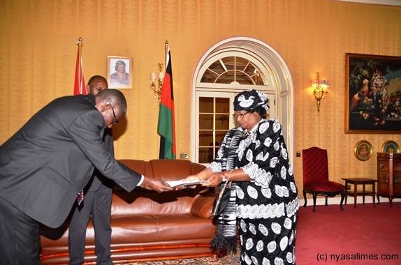 Receiving letters of credence from His Excellency Mr Charles Romel Banda the new Zambian High Commissioner to Malawi.