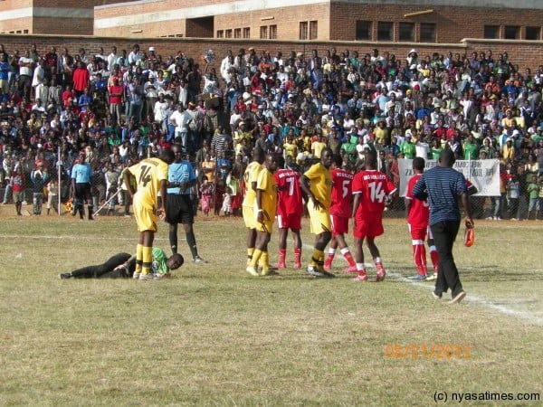 ReF Denis Ngulube calls for first aid attention as KB goalie Lehman Nthala gets injured, Pic Leonard Sharra