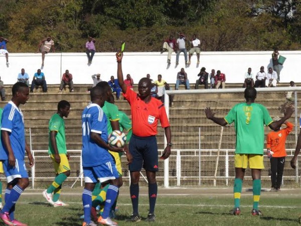 Referee Patrick Ngoleka books Lanjesi during the game