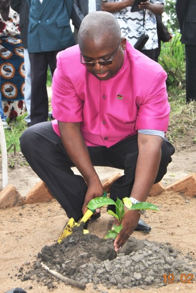 Right Rev. Malasa, Bishop of Anglican Diocese of Upper Shire also planting a tree during the tree planting exercise at Samama primary school in Mangochi - pic Mayamiko Wallace