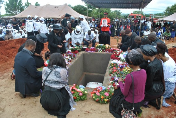 Rose Chibambo's grandchildren praying after laying wreaths    during the burial of their grand mother-Pix By Joel Chirwa( Mana) 