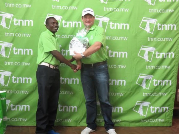 Runner-up Kachepatsonga gets his prize from TNM