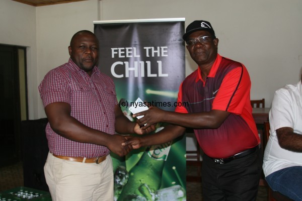 Runner up Mkandawire gets his prize from Kawamba