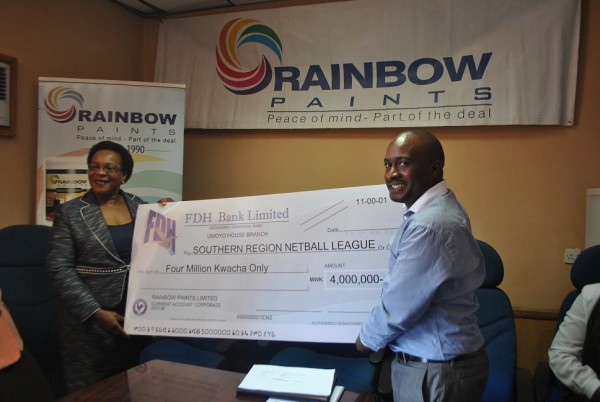 SRNL Chairperson Khungekire Matiya and Rainbow Paints Marketing Officer Bruno Sailas hold a dummy cheque....Photo Jeromy Kadewere, Nyasa Times