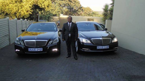 Salanje posing with his two top of the range mercs
