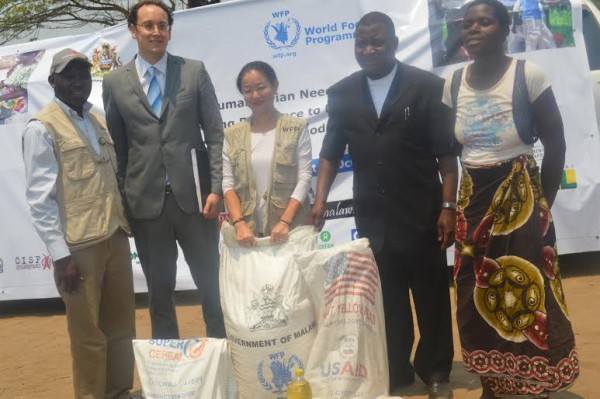 Sande --second from right and WFP country director Coco Ushiyama --centre