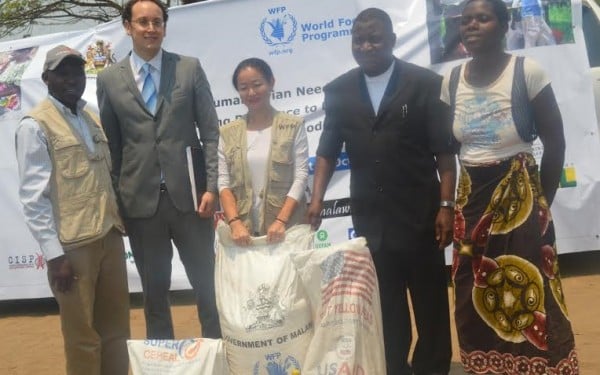 Sande --second from right and WFP country director Coco Ushiyama --centre