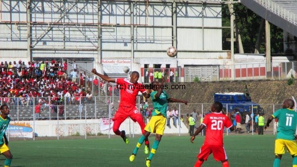 Sankhani Mkandawire up in air trying to clear the ball.....Photo Jeromy Kadewere