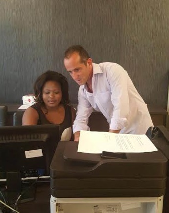 Savva Constatinou helps a student at UNICAF University Malawi