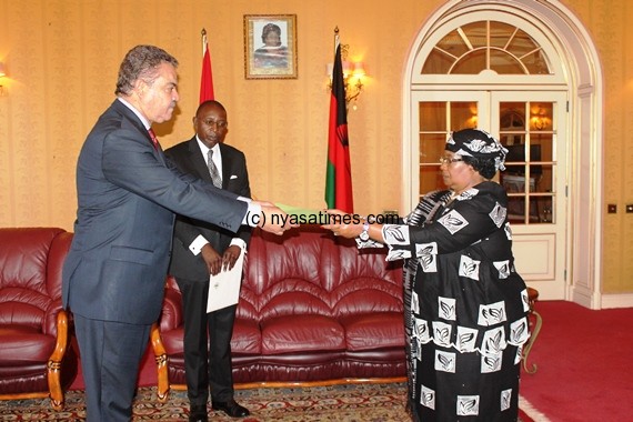 Seychelles diplomat Claude Morel presenting letters of credence to Dr Joyce Banda.