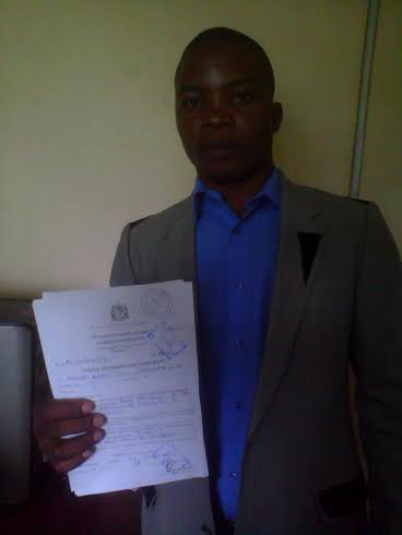 Shaibu displaying the PI documents from Tanzanian Authorities
