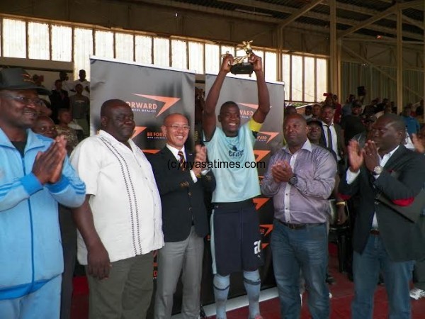 Silver captain Lucky Malata shows off the trophy, Pic Alex Mwazalumo