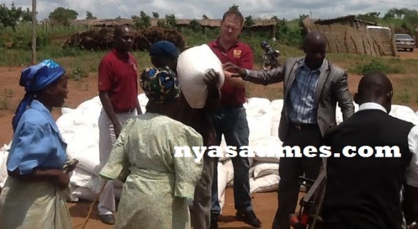 Simama Hotel manager giving out the maize