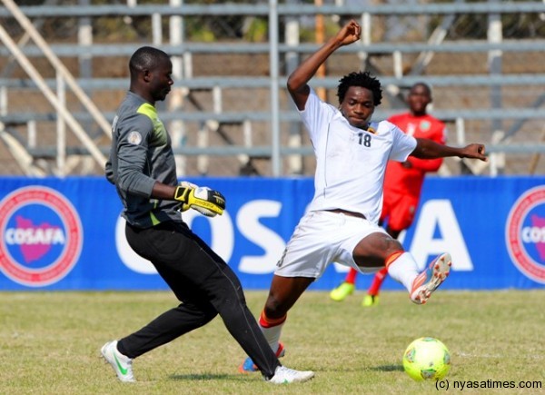 Simplex Nthara trying to challenge the ball from the man who converted two goals for  Angola...Photo Cosafa.