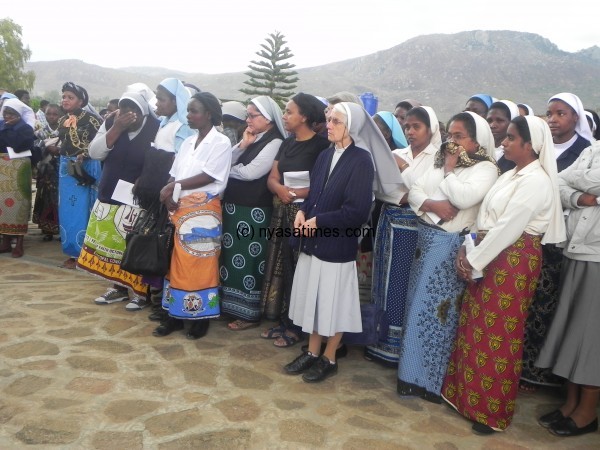 Sisters outside the church