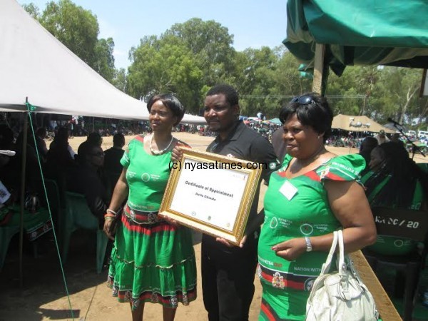 Skeffa Chimoto showing the certificate.-Photo by Tiwonge Kumwenda-Nyasa Times