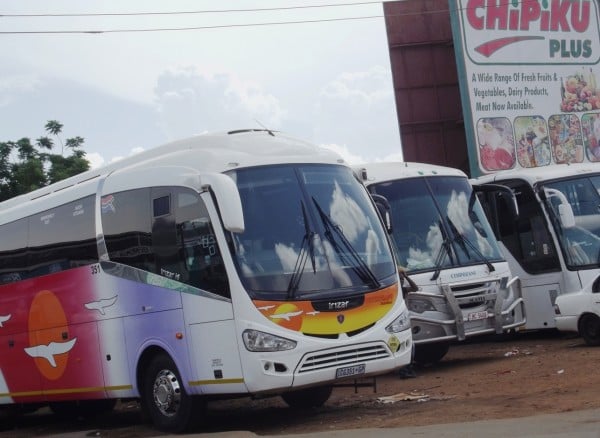 South Africa bound buses captured at one of the open makeshift terminals in Malawi capital, Lilongwe Pic. by Kondwani Magombo
