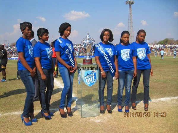 Standard Bank Models with the glittering trophy: No more knock-out