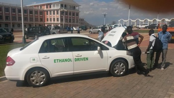 Students appreciating Ethanol driven car